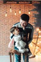 Dad and son on a background of a brick wall photo