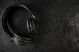 Headphones on a black stone background photo