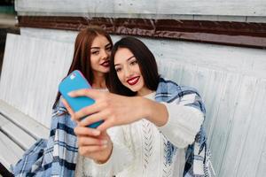 Two girls make selfie photo