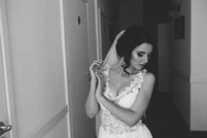 Bride posing in a corridor photo