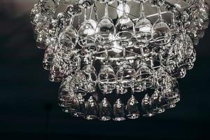 Beautiful chandelier made with glasses of wine photo