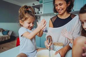 Happy family cook together in the kitchen photo