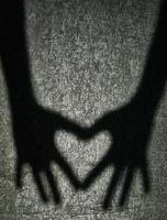 Two shadows hands photo