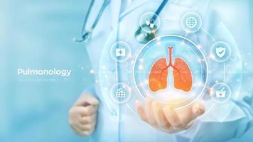 Pulmonology medicine concept. Respiratory system examination and treatment. Doctor holding in hand the hologram of Lungs and medical icons network connection on virtual screen. Vector illustration.