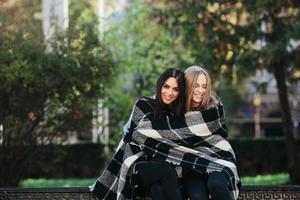 two beautiful in the park, posing for the camera photo