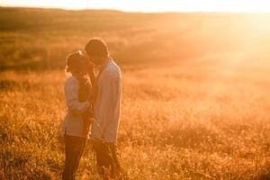 Couple running to the sunset photo