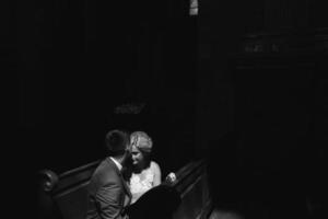 bride and groom illuminated by light photo