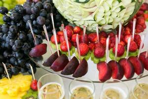 Cocktail with fruits, grapefruit, grapes, apples, pomegranates, strawberries photo