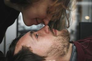 Vintage couple . Girl kiss her boyfriend from above  .Coffee shop photo