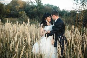 Lovely couple spends time in the field photo