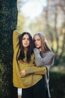 Two girls posing in the park photo