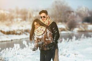 Happy couple in snow park photo