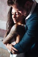 Beautiful, young couple posing on camera indoors photo