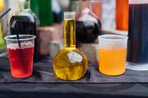 Multicolored alcoholic and non-alcoholic cocktails with straws photo