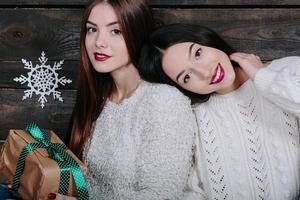 portrait of two beautiful girls at Christmas photo