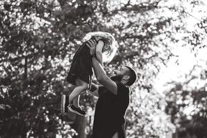 Dad and little daughter have fun and playing photo