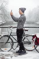 Guy is standing on a bridge photo