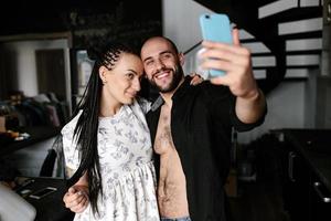 man and woman making selfie photo