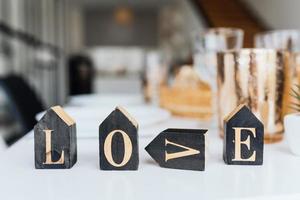 Word Love on wooden cubes, close-up. Valentine concept photo