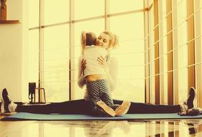 Mother and daughter hugging in the gym photo