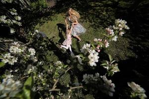 mother twist daughter in the garden photo