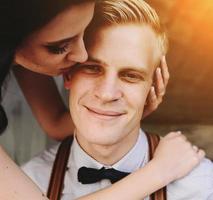 Bride leaning on the groom photo