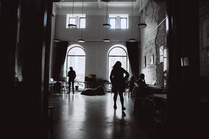 Silhouettes of several colleagues communicating in office photo