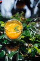 Fresh passion fruit and a glass of passion fruit drink photo