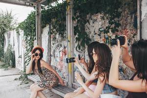 Four beautiful girls at the bus stop photo