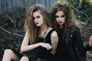 Two vintage witches gathered eve of Halloween photo