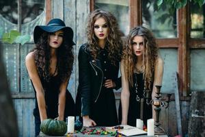 three witches at the table photo