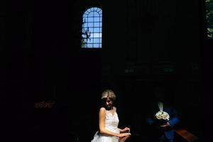 bride and groom illuminated by light photo