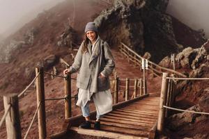 Girl climbs the path to the mountain photo