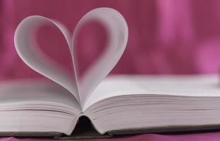 Open book with heart shape photo