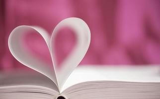 Open book with heart shape photo