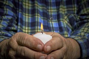 Hands and candle photo