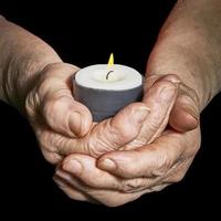 Hands and candle photo