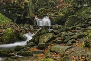 Autumn waterfalls with stones photo