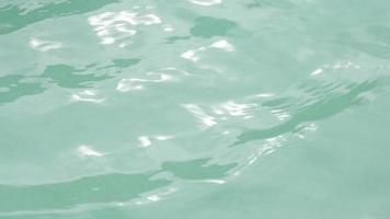 Water background. Ripples and water surfaces in the swimming pool. video
