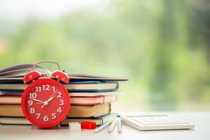 Object education green nature background with stack of ancient books or old bible, open paper book on wooden table with copy space. concept of back to school, research study photo