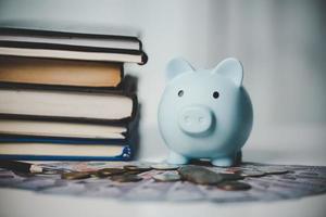 close-up education object with stack money coin-cash dollar and glass jar on background. Concept to saving money income for study, Calculating student finance costs and investment budget loan photo