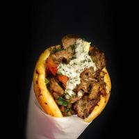 GREEK GYRO product shot, black bokeh background premium photo