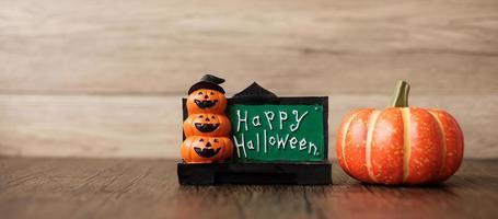 Orange pumpkin on table with copy space for banner background. Happy Halloween day, Hello October, fall autumn season, Festive, party and holiday concept photo