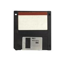 Black 3.5 floppy disk with tag for writing messages. on a isolate white background.Computer devices in the 90s for recording data.top-down,front view,top view,flat lay. photo