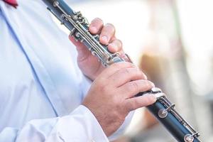 Fingers of a clarinet player photo