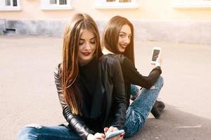 Two young adult girls photo