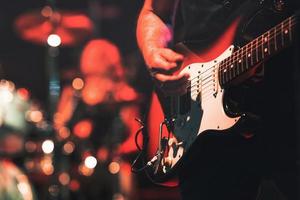 Electric guitar played during a show photo