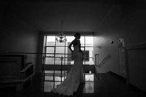 bride posing on wedding day photo