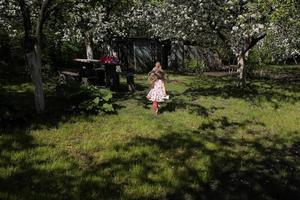 mother and daughter in the garden photo