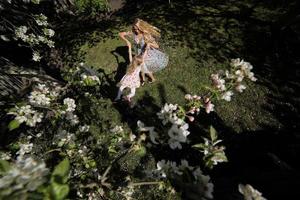 mother twist daughter in the garden photo